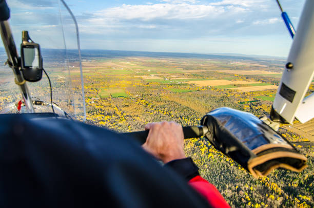 istock Pilot flying in his ultra light plane 1280616590