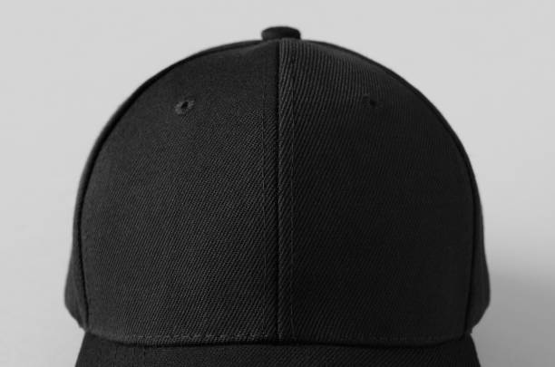 istock Black baseball cap mockup on a grey background, closeup. 1280622416