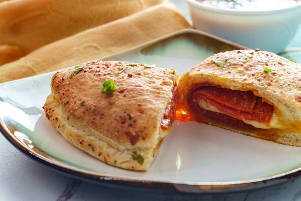 italienische pepperoni cheese calzone - pizza pastry crust oven meat stock-fotos und bilder