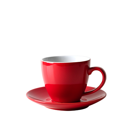 Red empty cup for coffee isolated on red background. Close up.