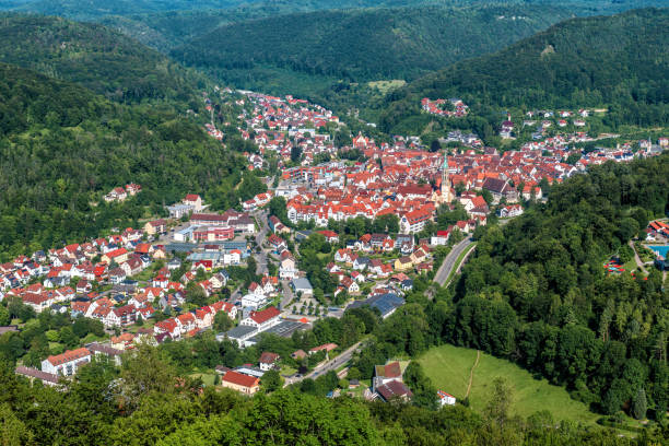 Aerial view of town of Bad Urach, Germany. Panorama of small city in Swabian Alps, inhabited locality in Baden-Wurttemberg. Aerial view of town of Bad Urach, Germany, Europe. Panorama of small city in Swabian Alps, inhabited locality in Baden-Wurttemberg. Terrain with forest and houses, summer landscape taken from above. reutlingen stock pictures, royalty-free photos & images
