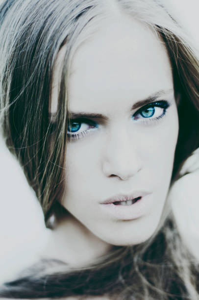 Portrait of young beautiful model outdoors with blue eyes and nice hairstyle. with. interested post production