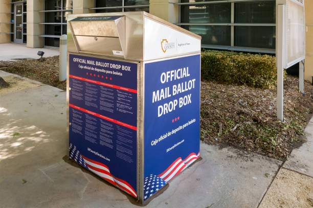 An Official Mail Ballot Drop Box for San Bernardino County Victorville, CA / USA – October 9, 2020: An Official Mail Ballot Drop Box for San Bernardino County is placed at the Victorville City Hall building in Victorville, California. absentee ballot photos stock pictures, royalty-free photos & images