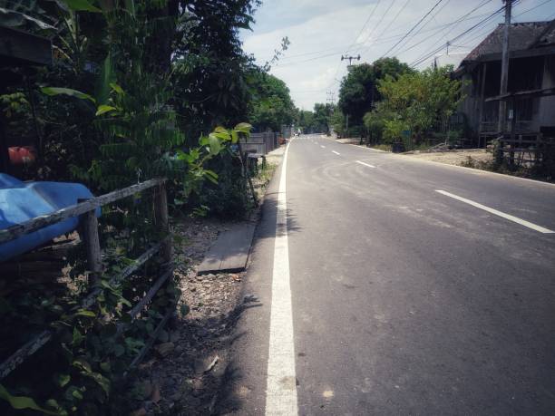 istock One simple village road 1280643931