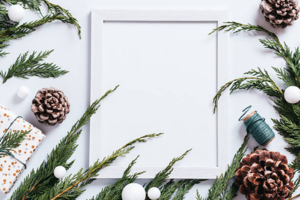 istock Christmas frame with pine cones, cedar branches, presents and decorations. Christmas mockup, copy space 1280643934
