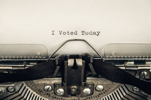 istock typing motivational slogan I voted today on a vintage typewriter close-up 1280644623