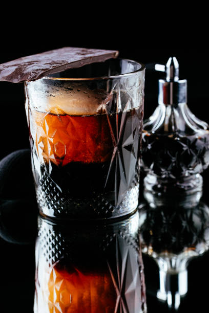 istock alcoholic cocktails on a mirror background 1280652173