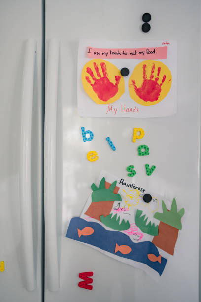 istock artwork and magnets hanging on fridge 1280653014