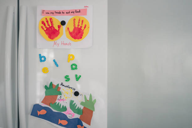 istock handprint art and magnets on white fridge 1280653030