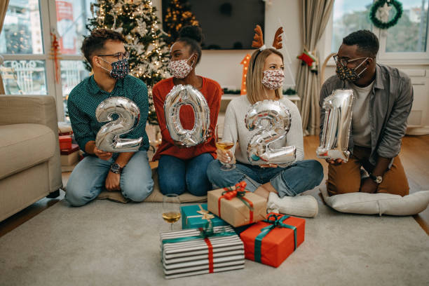 istock Young millenials celebrate New Year under COVID 1280656251