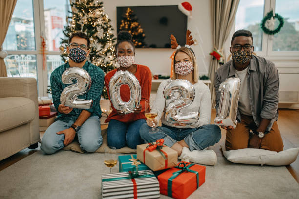 istock Young millenials celebrate New Year under COVID 1280656420