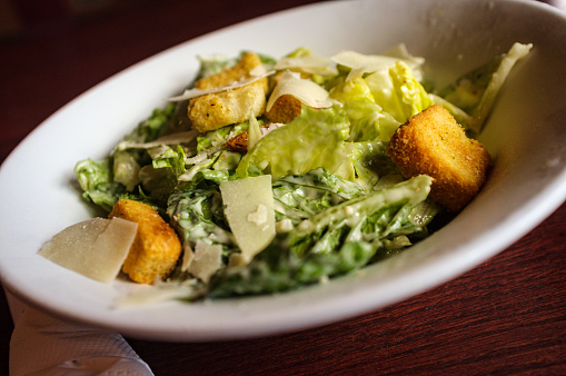 Fresh Caesar salad with croutons and parmesan cheese