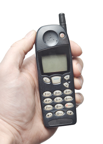 Closeup of a retro cellular phone from the 1990s.