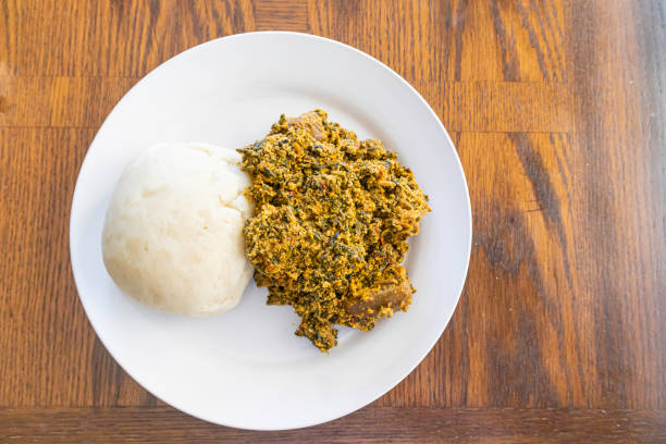 istock Nigerian Egusi Soup served with Pounded yam 1280669361