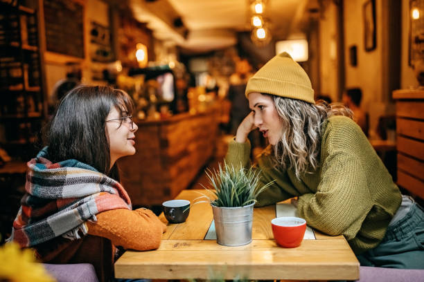istock Girls talking in coffee shop 1280680499
