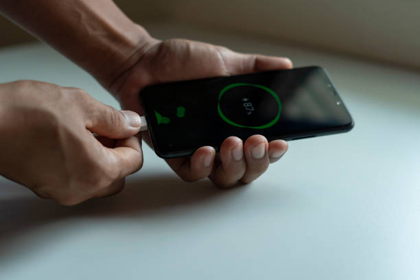 istock man recharge your home smart phone on your desk 1280681219