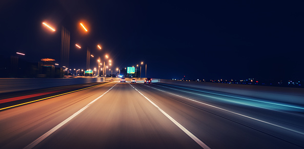 Night cars driving on Van Wyck Expressway, Queens, New York