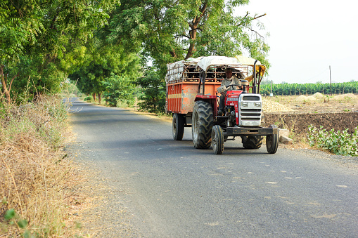 Jargon, India - April 14, 2020: Indian farmer with tractor on road