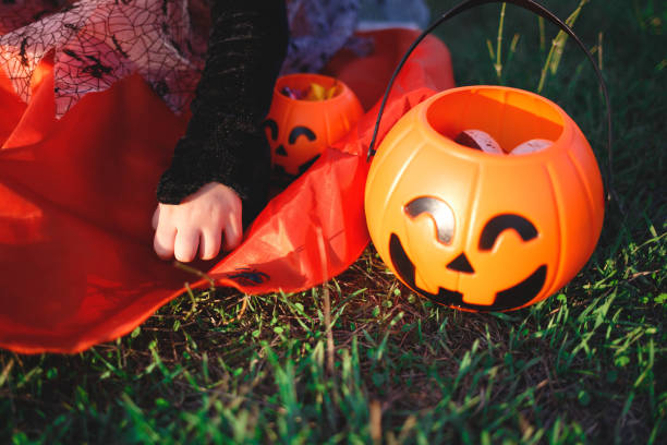 istock halloween candy baskets lie on the grass 1280688484
