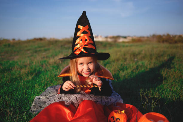 istock little girl dressed as a witch celebrates halloween 1280688485