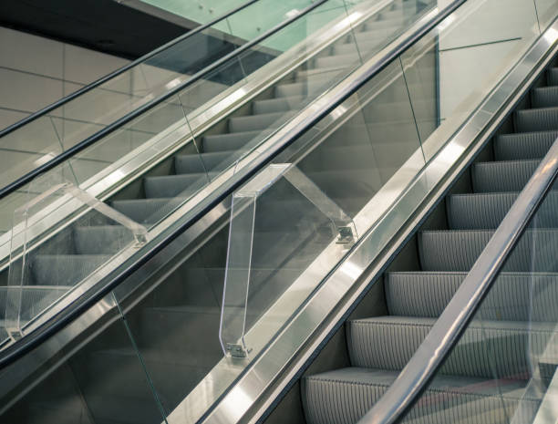 istock Modern escalator in a metro station in Bucharest. Moving up staircase. 1280689569