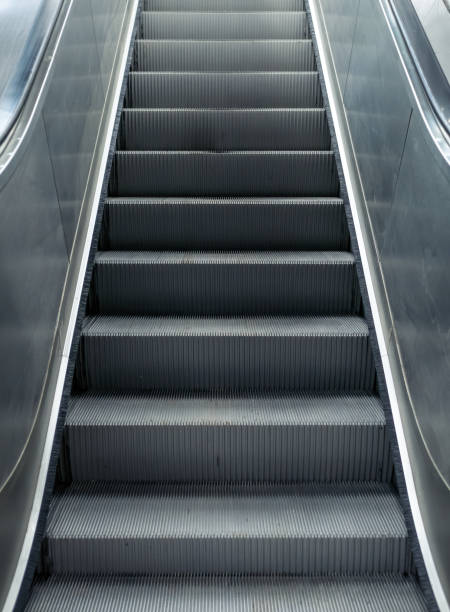 istock Modern escalator in a metro station in Bucharest. Moving up staircase. 1280689571