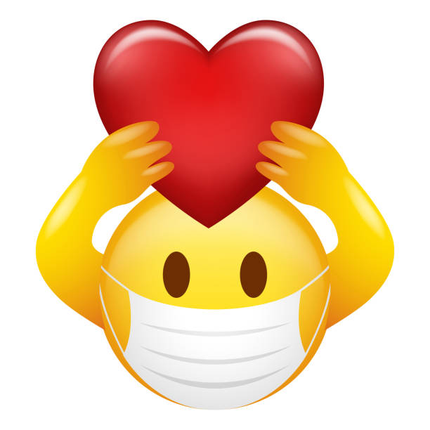 istock Emoticon wearing medical mask holding heart symbol 1280693372