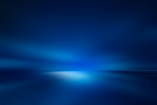 Blurred rays of light abstract blue background