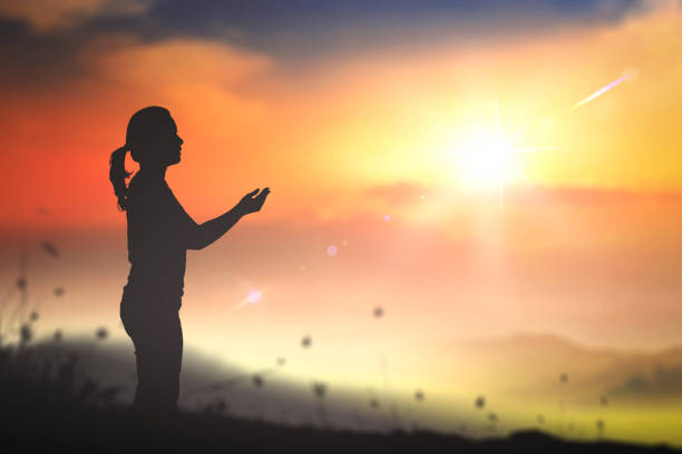 istock Woman praying to God concept 1280697510