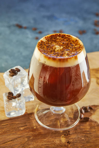 istock Cold drink or Nitro Coffee drink in a glass with foam, ice and coffee beans 1280697559