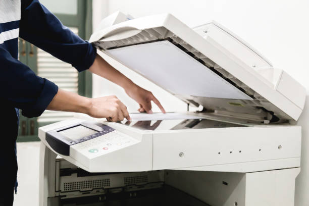 istock Business people keypad hand on the panel printer, printer, scanner, laser copier, office equipment, concept, start working 1280698724
