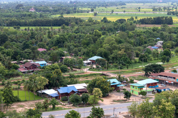 istock Above the forest in the village and green rice fields. 1280700711