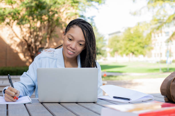 istock Beautiful adult student studying outdoors 1280700773