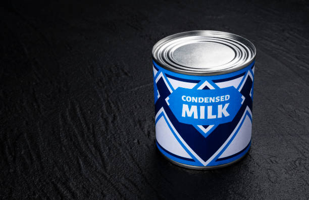 istock Condensed milk can on black background 1280703454