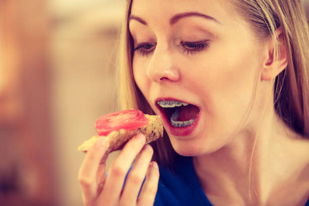 istock Woman having healthy breakfast eating sandwich 1280714110