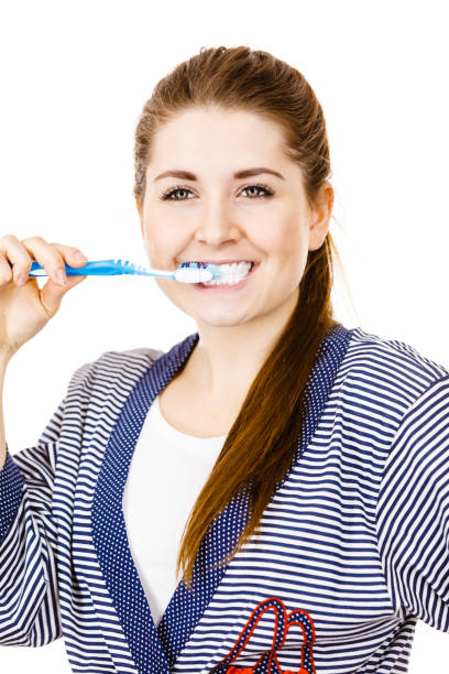 istock Woman brushing cleaning teeth. 1280715295