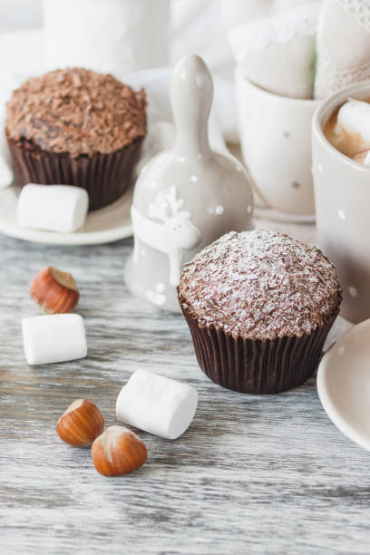istock Cups with cacao and marshmallow, cupcakes and different decorations 1280716852
