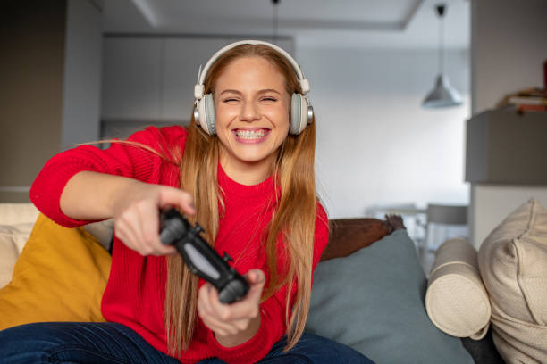 Young woman is playing video games