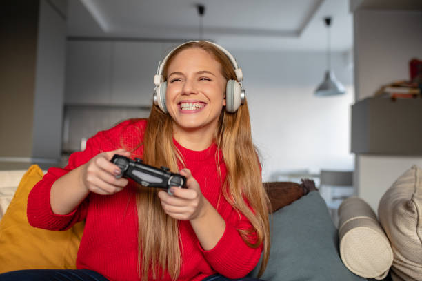 istock Young woman is playing video games 1280717595