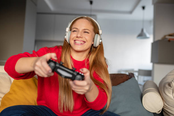 istock Young woman is playing video games 1280717604