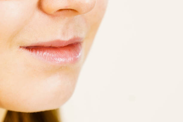 istock Girl with no makeup, part of face lips 1280717932