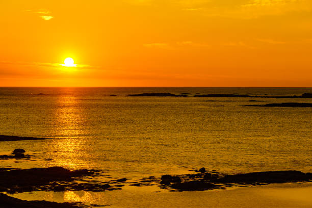Seascape on Andoya island, rocky coastline at midnight sun during summer, Vesteralen archipelago, Norway.