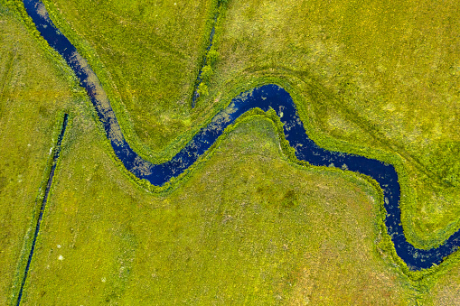 Aerial top down view of meandering lowland river Koningsdiep near Beetsterzwaag in the Netherlands