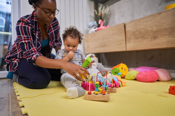 Mother using a Montessori education to help her son to develop his creative skills