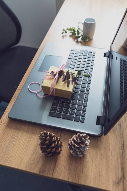 istock Give away a virtual gift on a laptop 1280722388