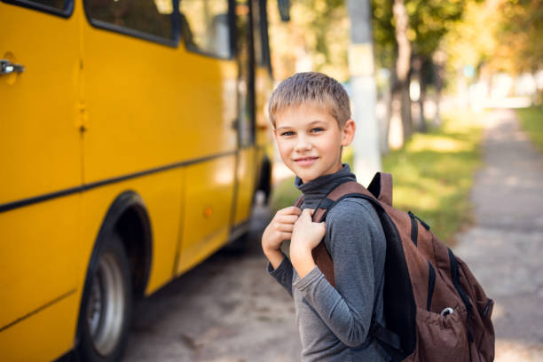 istock School learner going to a school bus after lessons afternoon. 1280722683