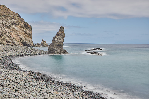 Larga exposición en el litoral de la Gomera, España. Playa de la Caleta. Formación rocosa en una playa de La Gomera, España. photo