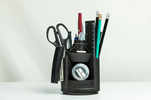 Black pencil tool holder table desk organizer isolated on white