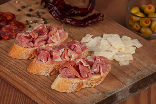 istock Delicious Spanish appetizer of Iberico ham with cheese and olives 1280732380