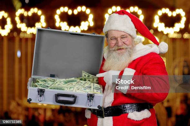 Santa Claus Holding Suitcase With Money Stock Photo - Download Image Now - Santa Claus, Currency, Gift